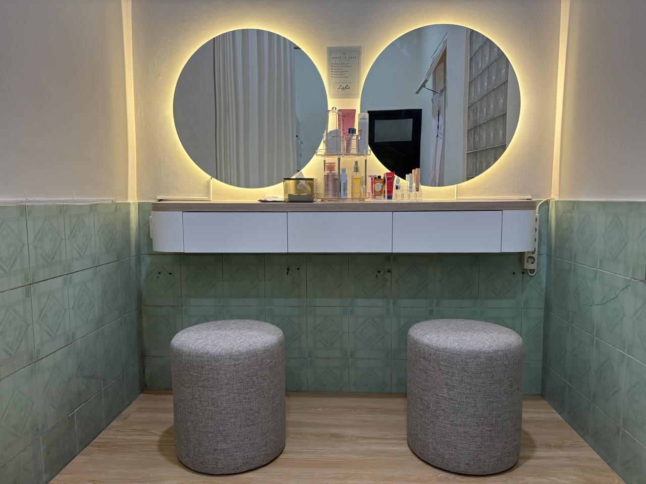 Dressing table with lit mirrors