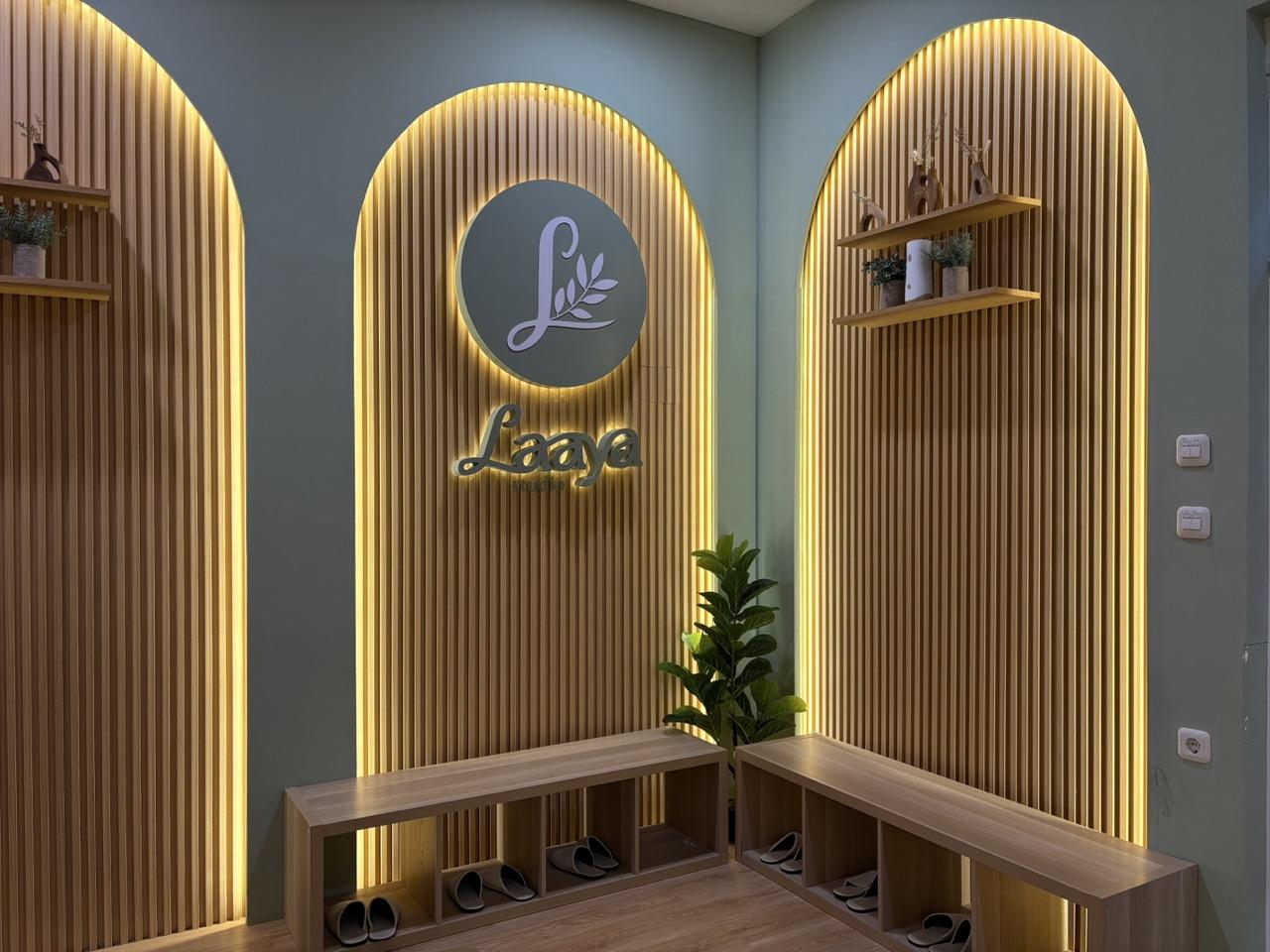 Waiting area with backlit arches and Laaya logo